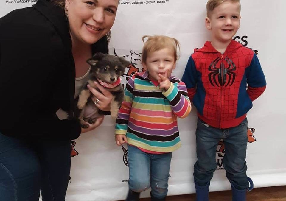 cute kids and their adopted puppy WAGS