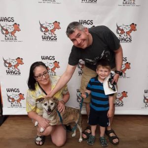 happy family enjoy new pet dog WAGS