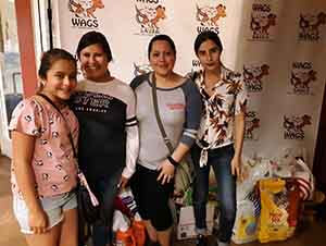 family donate goods at WAGS
