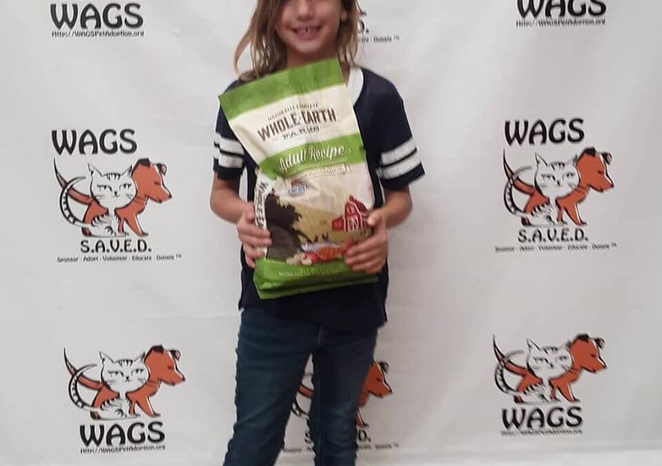giana with pet food and treats donation WAGS