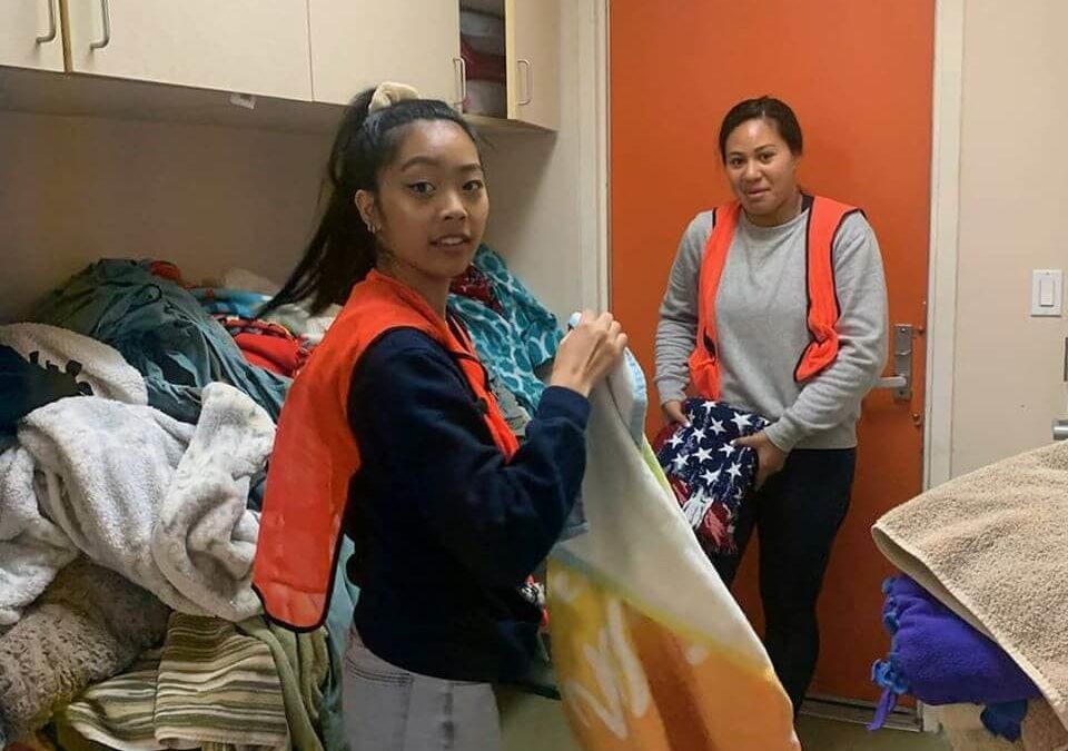two volunteers for WAGS taking care of laundry